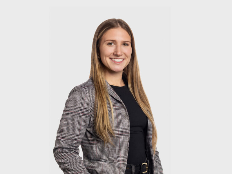 Jaden Sciotti, a blonde woman wearing a gray blazer and black professional shirt.