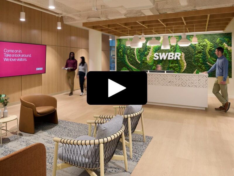 A picture of the entry lobby at the SWBR headquarters with a video "play" button overlaid.
