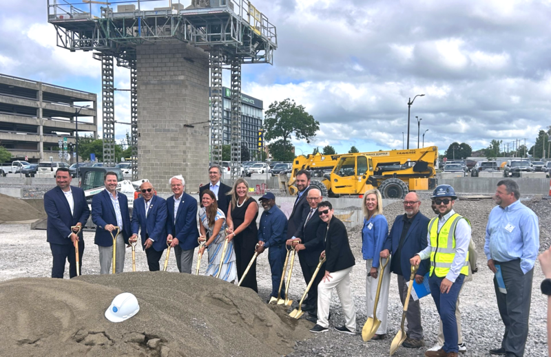 A group of project stakeholders posing for a photo with shovels at the groundbreaking for the Nest in Niagara Falls, NY.